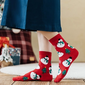 Festive red Christmas crew socks featuring snowman and Christmas tree patterns for women