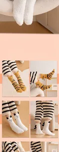 Detail of warm coral fleece socks featuring cute 3D animal ears and tail design