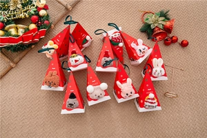 Close-up of Christmas coral fleece socks in 3D cartoon animal gift boxes with hanging ropes