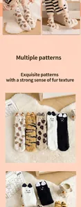 Detail of coral fleece winter socks with 3D animal ears and embroidered patterns