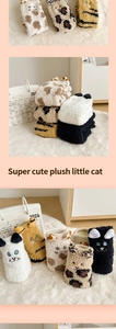 Detail of five cute cat-shaped thick coral fleece socks in various patterns and colors