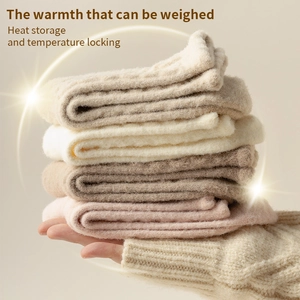 Thick knit thermal socks for women in soft beige and pink tones held in hand