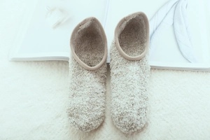Close-up of soft beige fleece floor socks showing ultra-fine plush texture and warmth
