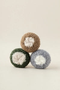Detailed view of plush coral fleece fabric texture in brown, green, and gray colors