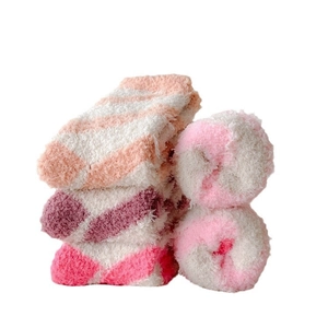 Striped coral fleece warm winter socks for women in soft orange and purple tones