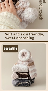 Detailed close-up of soft thick coral fleece striped socks showing plush fabric texture
