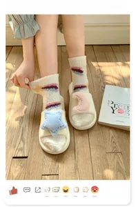 Cozy home slippers with blue star and pink moon patches on warm beige plush fabric