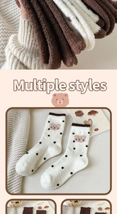 Detailed close-up of thick plush coral fleece socks with cute brown bear embroidery