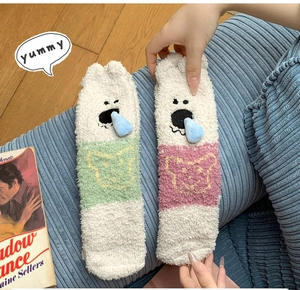 Detail of coral fleece socks with cute cartoon bear embroidery and 3D plush ear design
