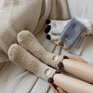 Plush 3D cartoon thermal socks in brown, grey, and white with thick coral fleece material
