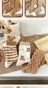 Winter thermal fleece socks with bear patterns and soft storage bag shown in detail