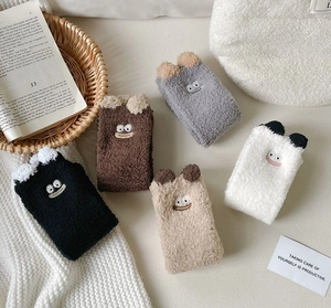 Detailed view of 5-pack cute cartoon coral fleece socks with 3D ears and embroidery