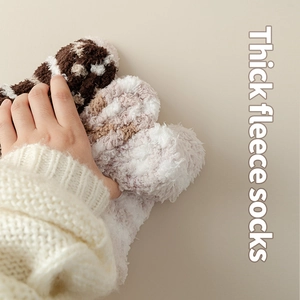 Thick coral fleece crew socks for winter warmth with a soft striped fluffy texture