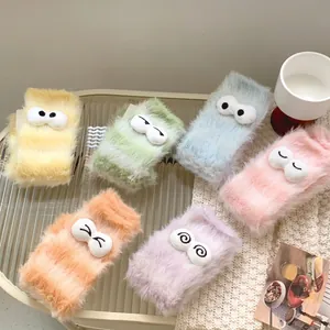 Plush coral fleece socks with cute cartoon eyes in various pastel macaron colors