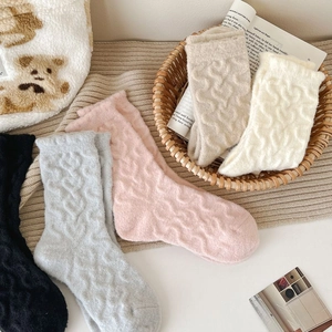 Detail of warm cable knit thermal socks in five colors including cream and grey