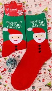 Christmas cotton socks with red and green patterns and Santa Claus motif with tag