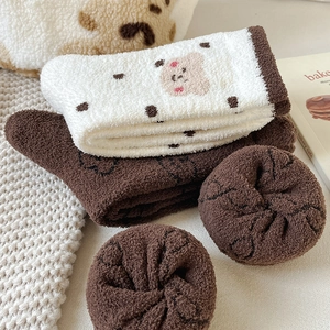Thick winter fleece socks for women featuring cute brown bear patterns and warm plush texture