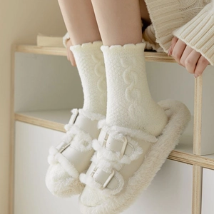 Plush cream slippers with double buckles and matching cable knit thermal socks for winter