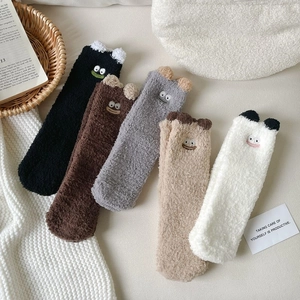 Five pairs of cute cartoon smile coral fleece socks in neutral tones for home wear