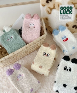 Close-up of soft coral fleece socks with 3D cartoon animal ears and delicate embroidery