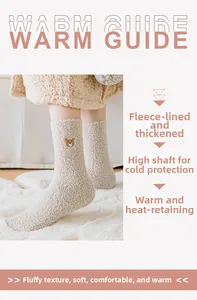 Close-up of beige coral fleece socks with cute bear embroidery and warm plush texture