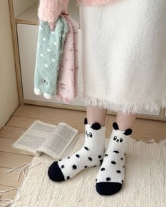 Detailed view of thick coral fleece mid-calf socks with cute 3D cartoon panda design