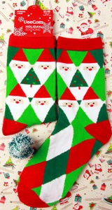 Women's Christmas crew socks with Santa Claus and tree patterns on festive gift wrap