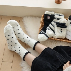 Thick coral fleece panda socks for women with warm plush material and cute embroidery