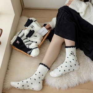 Thick coral fleece panda socks for women with cute patterns and ruffles in a cozy home setting