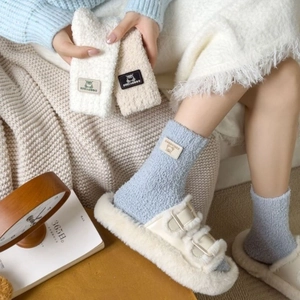 Plush coral fleece mid-calf socks with bear patch in soft blue and cream tones