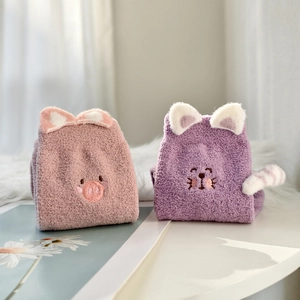 Detail view of plush cartoon thermal socks with cute 3D animal ears in pink and purple