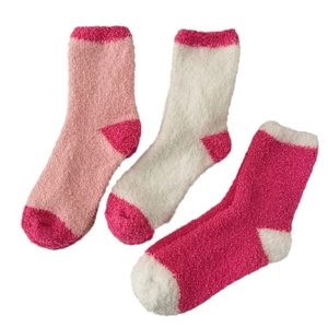 Three pairs of thick coral fleece winter socks in pink, beige, and rose for cozy home sleep