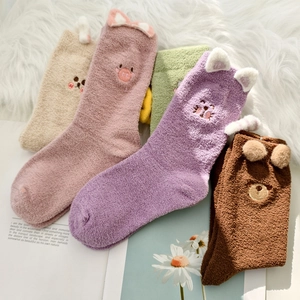Thick coral fleece crew socks set featuring cute animal faces and warm plush texture