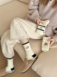 Detailed embroidery of cute dog and bear on thick warm white fleece crew socks
