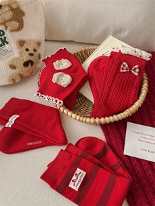 Detailed set of red cotton socks featuring bowknots, lace trims, and cute embroidery