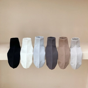 Detail of multi-color breathable mesh knit socks with ribbed cuffs in various soft tones
