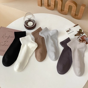 Six pairs of cotton sports ankle socks in assorted neutral colors with ribbed cuffs
