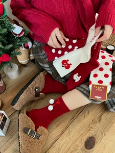 Cozy Christmas themed red cotton socks set with festive gift box and holiday decor