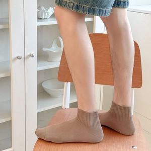 Close-up of men's coffee brown ribbed cotton socks with breathable mesh detailing