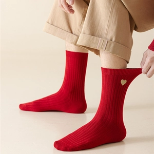 Close-up of red ribbed mid-calf socks with gold heart embroidery for Chinese New Year