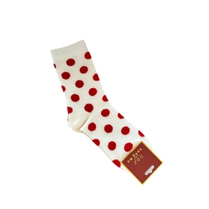 Polka dot knitted cotton socks for women with festive red patterns and brand tag