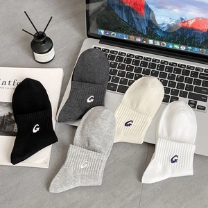 Detail of five-pair cotton sport socks set with G embroidery and ribbed cuffs