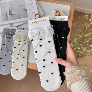 Japanese style Lolita socks with lace trim, ribbon bows and tiny heart patterns in four colors