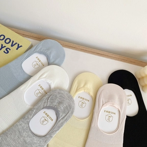 Detailed texture of vertical ribbed silicone non-slip invisible socks in pastel colors