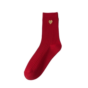 Red cotton crew socks with ribbed texture and gold heart embroidery for New Year