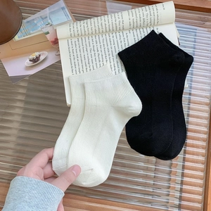 Bamboo fiber low cut socks with ribbed texture in solid black and cream white colors