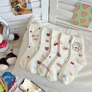 5-pack cute cream white crew socks with cherry heart patterns in a cozy home setting