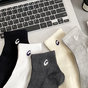 Five pairs of rib-knit cotton crew socks for men featuring G-letter embroidery in varied colors
