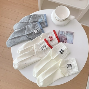 Detailed embroidery of cute puppy and letters on three pairs of premium cotton crew socks