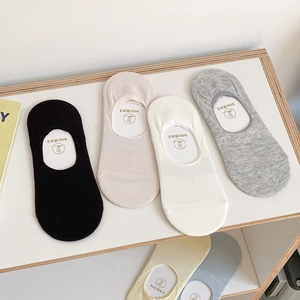 Detailed view of low-cut silicone non-slip invisible socks in various pastel colors